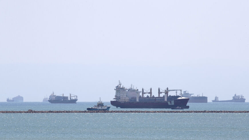 This picture taken on March 28, 2021 shows the Gibraltar-flagged container ship Indian Express (C-front) and the Panama-flagged container ship Elegant (C-behind) near the entrance of the Suez Canal, by Egypt's Red Sea port city of Suez. (Photo by Ahmed HASAN / AFP) (Photo by AHMED HASAN/AFP via Getty Images)
