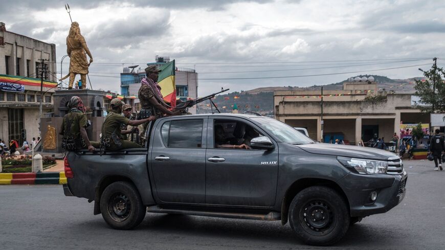 Members of the Amhara militia ride in the back of a pickup truck in the city of Gondar, Ethiopia.