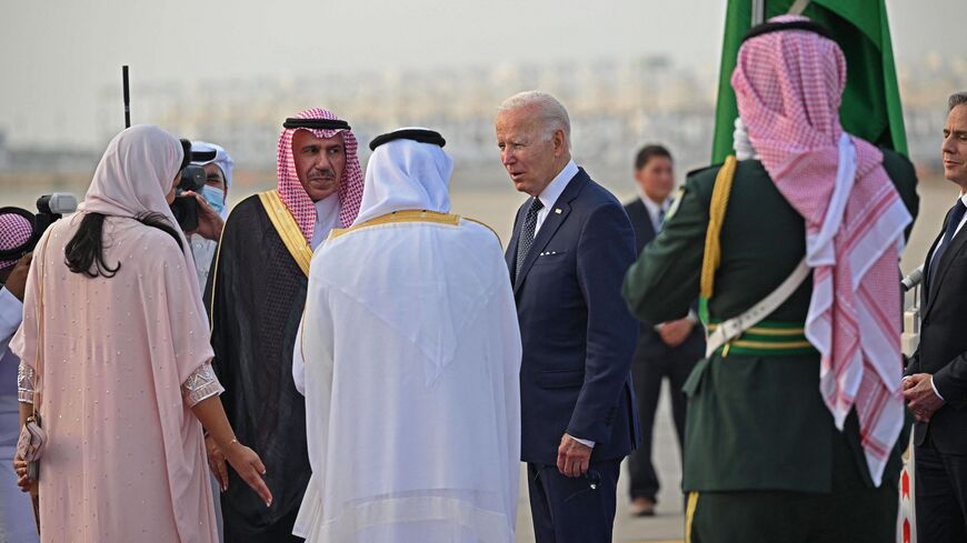 US President Joe Biden is welcomed by Mecca province governor Prince Khaled al-Faisal (white robe) and Princess Reema bint Bandar Al-Saud (L), Saudi Arabia's ambassador to Washington, at the King Abdulaziz International Airport in the Saudi coastal city of Jeddah, upon his arrival from Israel, on July 15, 2022.  