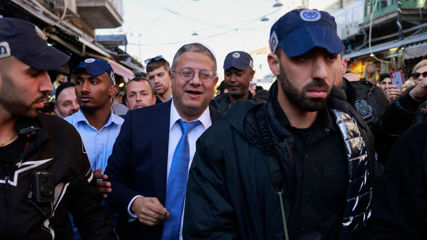 Itamar Ben-Gvir, Israel's new Minister of National Security and leader of the far-right Jewish Power party, greets supporters during a visit to Mahane Yehuda market, Jerusalem, Dec. 30, 2022.